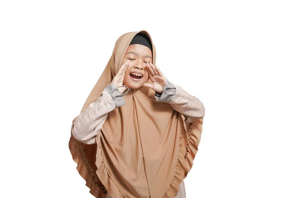 Fun asian muslim girls promoter in hijab brown outfit. Shouting hot news about sale discount with hand near mouth isolated on white background studio portrait.