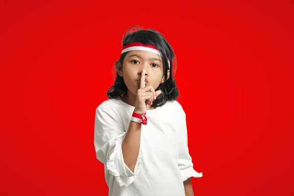 Isolated Girl Using Red White Ribbon Covering Her Mouth Saying — 스톡 사진