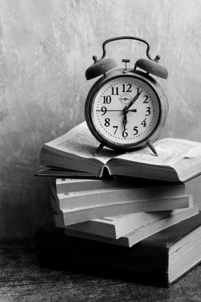 Open book on a desk. Simple composition still life with old books.