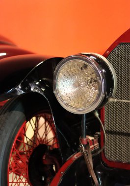 Retro car close up photo. Beautiful details of vintage auto. Headlight beam close up. 