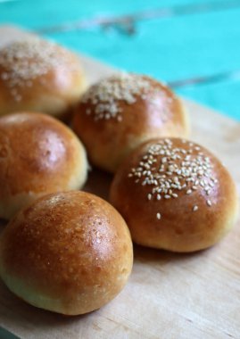 Home made burger buns close up photo. Sourdough bread on a table. Eating healthy concept. 