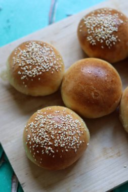 Home made burger buns close up photo. Sourdough bread on a table. Eating healthy concept. 