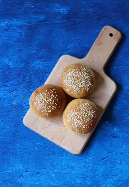 Freshly Baked Sourdough Buns Table Blue Textured Background Copy Space — Foto de Stock