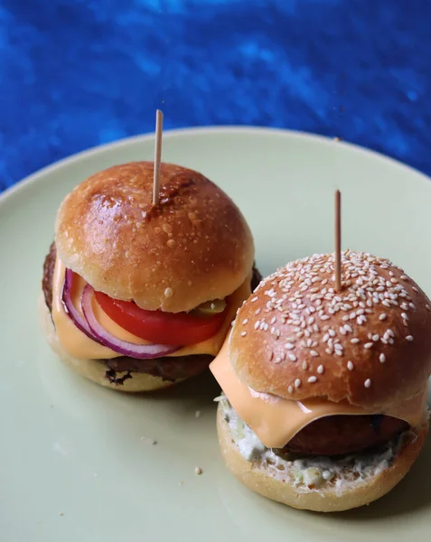 Vegetarian burger close up photo. Freshly baked sourdough buns for home made burgers. Eating healthy concept.