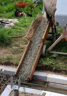 Concrete work in process. Cement foundation close up photo. Construction site photo. 
