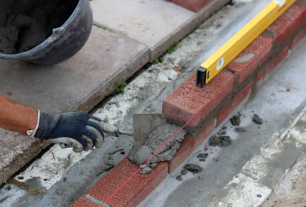 Close Photo Male Hands Holding Red Brick Construction Site Concept — Stok Foto