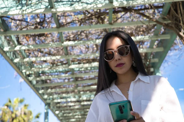 Young Beautiful South American Woman Sunglasses White Shirt Checking Social — ストック写真