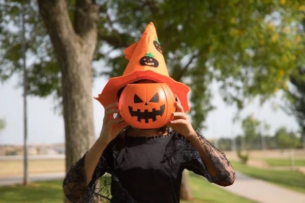Portrait Girl Black Shirt Orange Witch Hat Covering Her Face — Stock Fotó