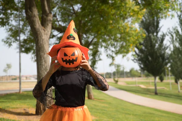 Portrait Girl Black Shirt Orange Witch Hat Covering Her Face — Stock Fotó