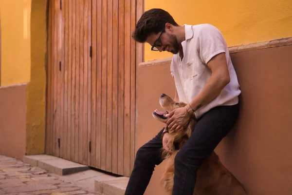 Young Hispanic Man Beard Sunglasses White Shirt Leaning Wall Hugging — Foto de Stock