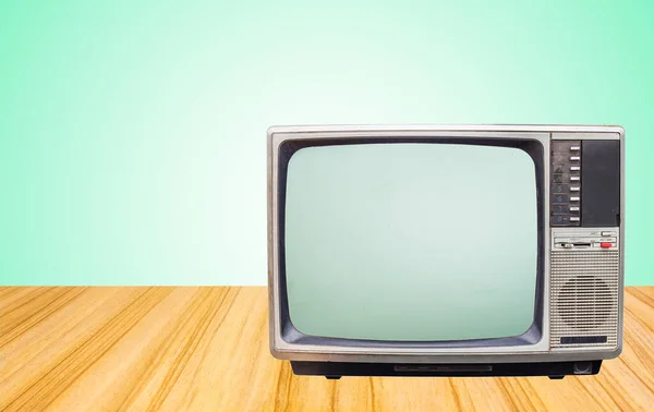 Masanın Yanındaki Eski Televizyon Alıcısı Yeşil Duvar Arka Planında — Stok fotoğraf