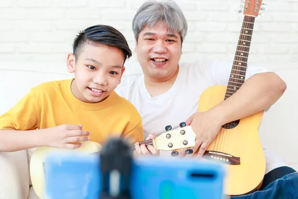 Asian Father Son Playing Music Together Home Living Room Live — 图库照片