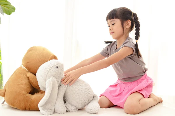 Cute Little Asian Girl Having Fun She Sits Teddy Bear — Zdjęcie stockowe