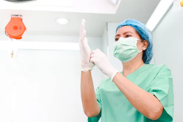 Nurses wearing masks and gloves in the operating room To be a doctor\'s assistant in treating patients. concept of medical services in a hospital. Copy space