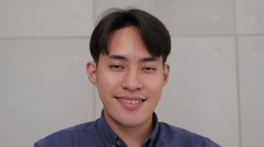 Smiling Asian businessman enjoying his work. Office worker. entrepreneur