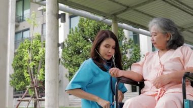 Asian female doctor checking the health of elderly patients. Concept of medical services in a hospital. surgical treatment of patients