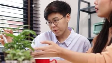 Asian LGBT couples work together at home. Small business entrepreneurs. Startups. Freelance. LGBT people.