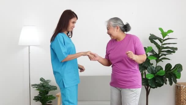 Female Doctor Elderly Female Patient Two Were Happy Dancing Together — Vídeo de Stock