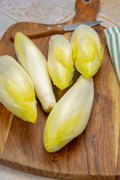 Several Raw Endives Wooden Board — Stock Photo, Image