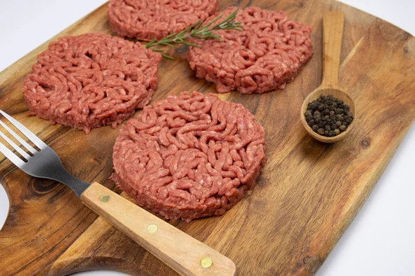 Several Raw Hamburgers Cutting Board — Foto Stock