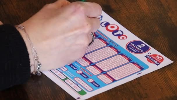 Woman Hands Closeup Filling Lotto Grid — Stockvideo