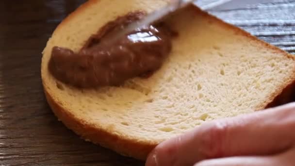 Spridning Kakaosmör Bröd — Stockvideo