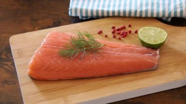 assorted raw fish fillet with pepper, lime and dill
