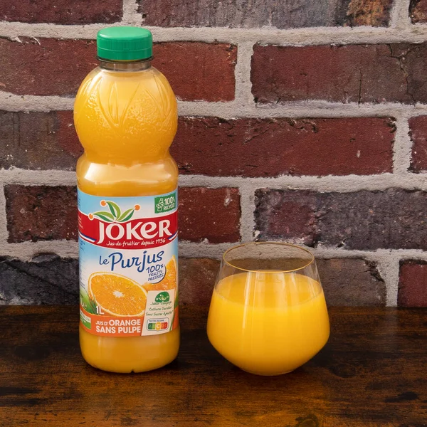 Joker Brand Orange Juice Bottle Glass Table — Stock Photo, Image