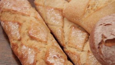 freshly baked breads on a wooden table