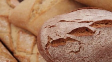 freshly baked breads on a wooden table