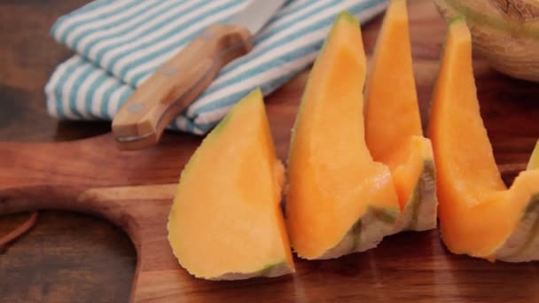 Fresh Ripe Sliced Melon Wooden Background — ストック動画