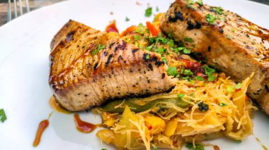 seared tuna steak and wok vegetables