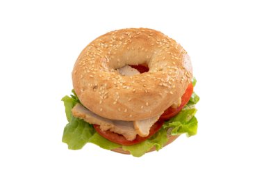bagel with chicken and raw vegetables isolated on white background