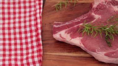 raw rib of beef on cutting board