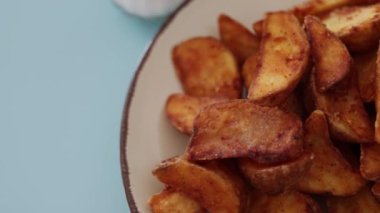 crispy fried potatoes on plate 