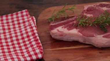 raw rib of beef on cutting board