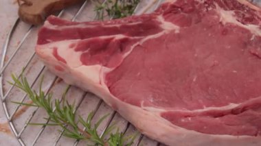raw rib of beef on cutting board