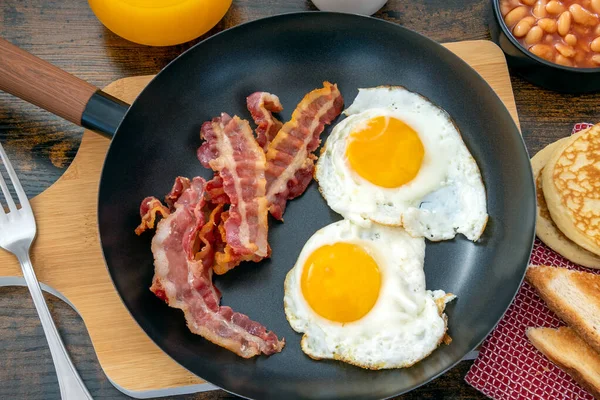 fried eggs with bacon