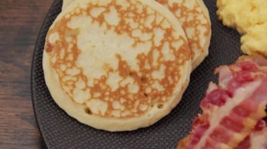 pancakes, omelet with bacon and toasts