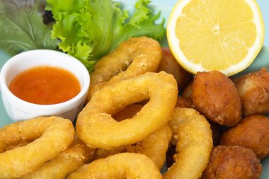plate of donuts and Roman squid close-up