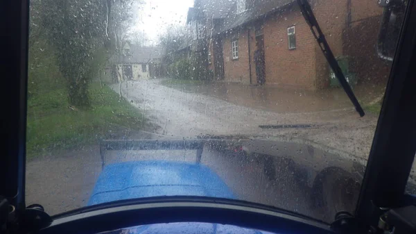 the transportation and mobility in a tractor during a rain shower