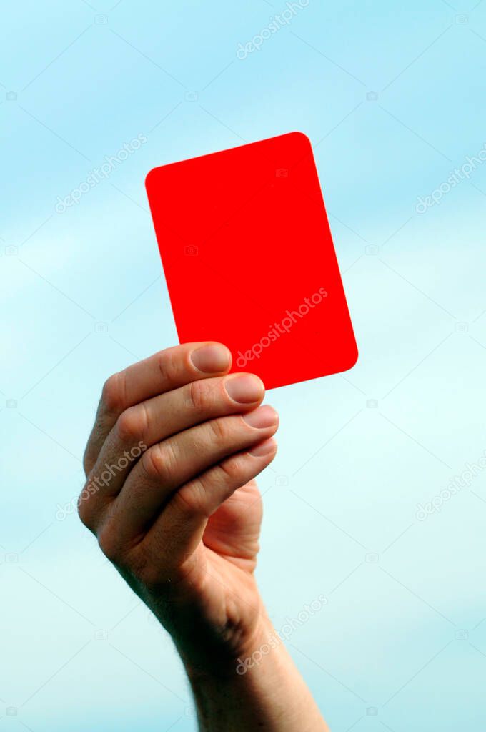 holding up a red card in the sky, symbol for stopping