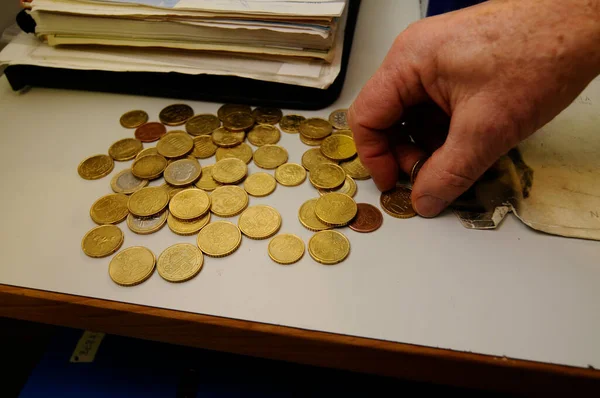 cash payment with euro coins, finances and means of payment