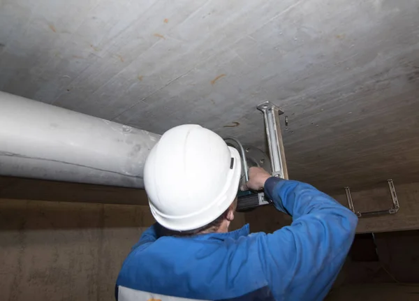 heating technician during repair and maintenance work in a building