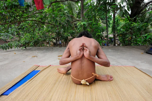 pashchima namaskarasana or reverse prayer pose, an exercise in yoga