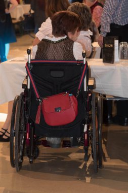 mobility and transport of an old person in a wheelchair