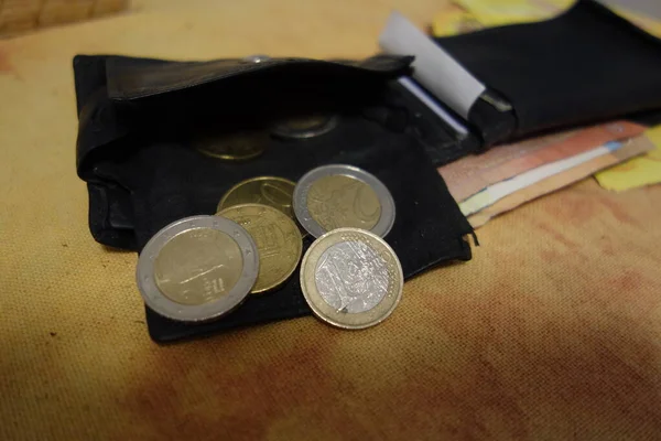 cash payment with euro coins, finances and means of payment