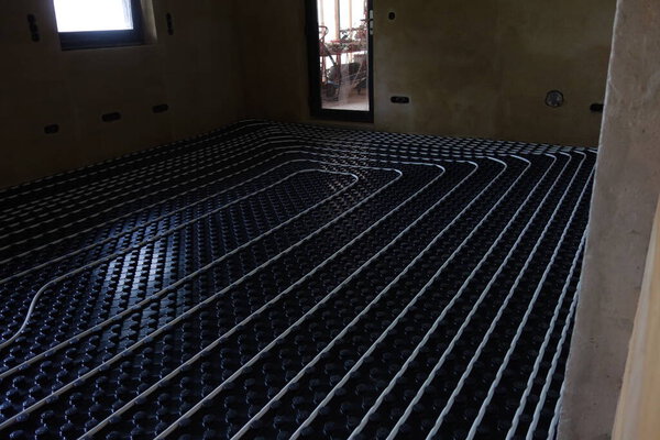 underfloor heating in a house with heating elements embedded in a floor