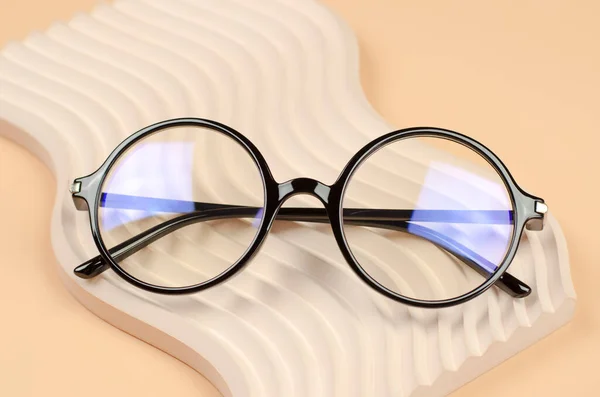 Stylish Glasses Vision Wavy Beige Podium — Stock Photo, Image