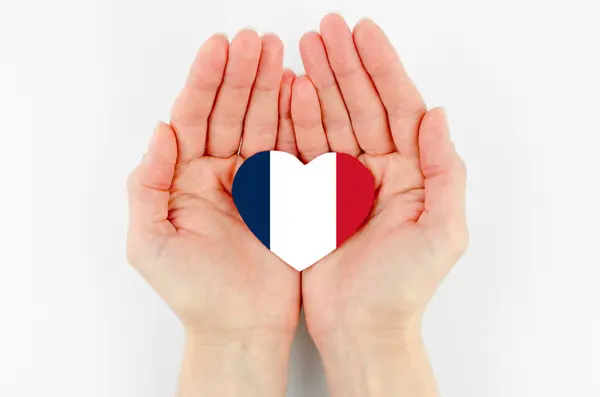 Francouzská Vlajka Tvaru Srdce Ženských Dlaních Bílém Pozadí — Stock fotografie
